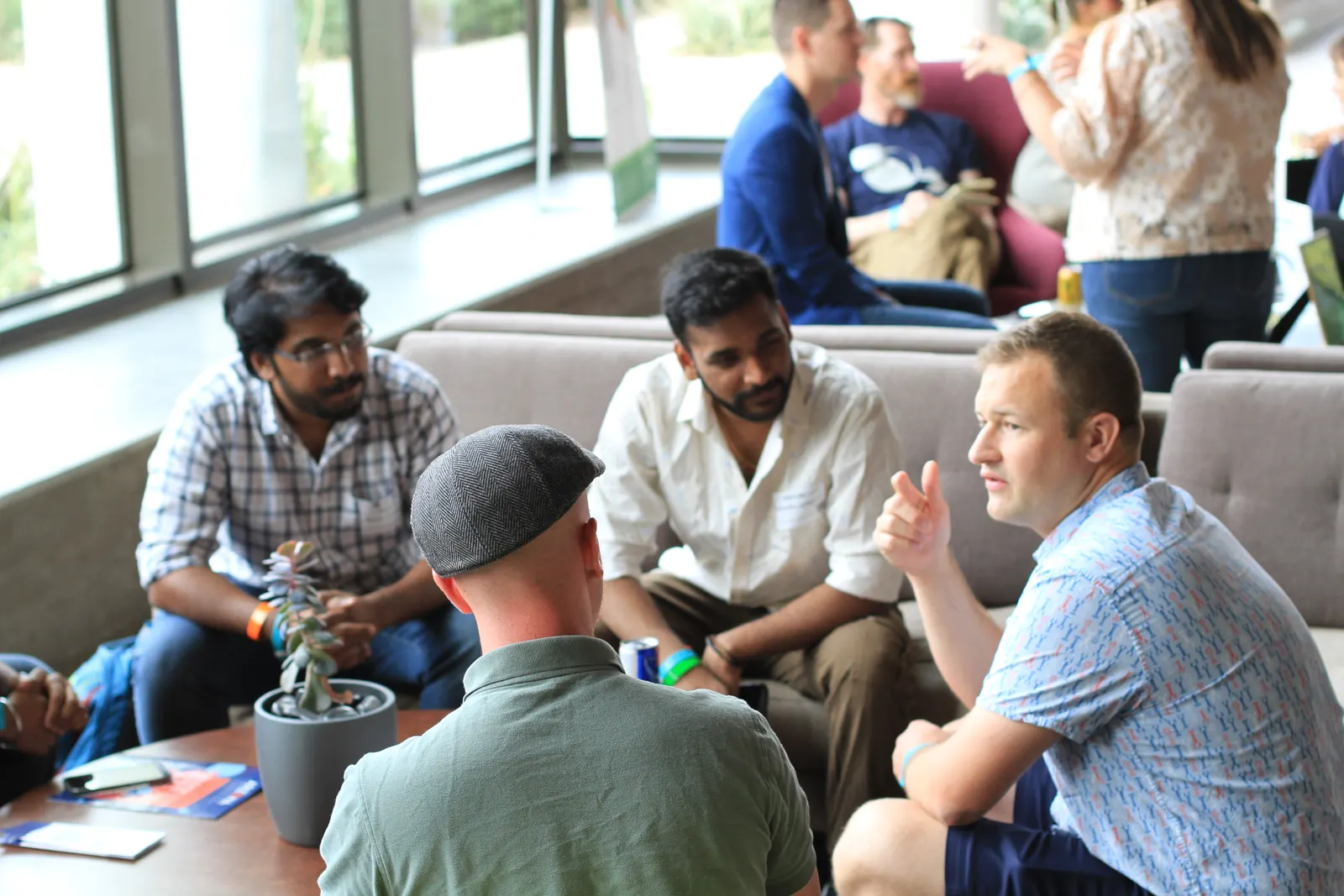 Guests talking in small groups at a Venture Café Phoenix Thursday Gathering